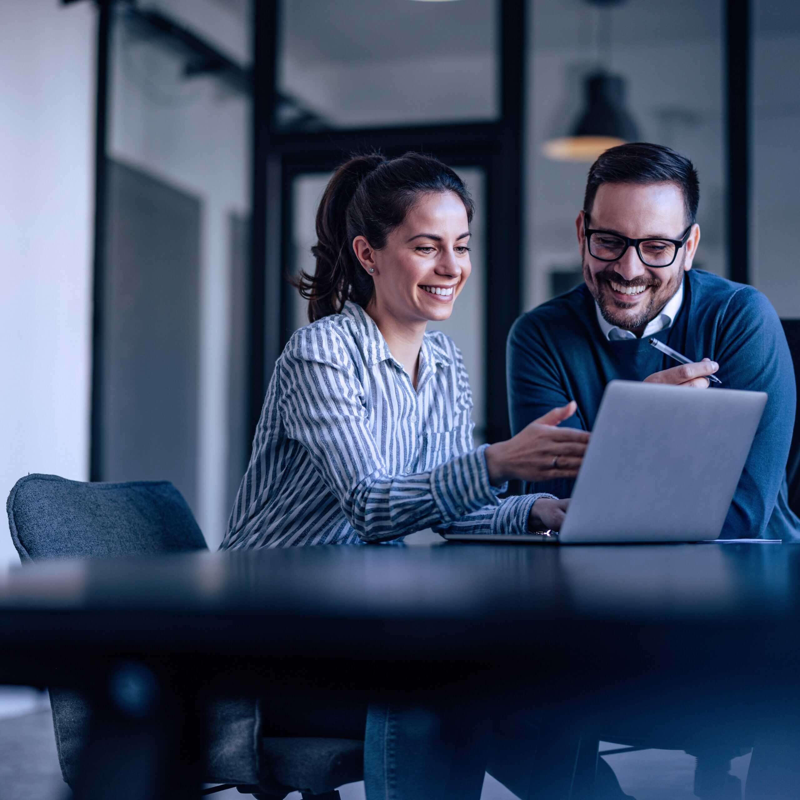 Portrait Of Two Business Colleagues, Looking At Something Online