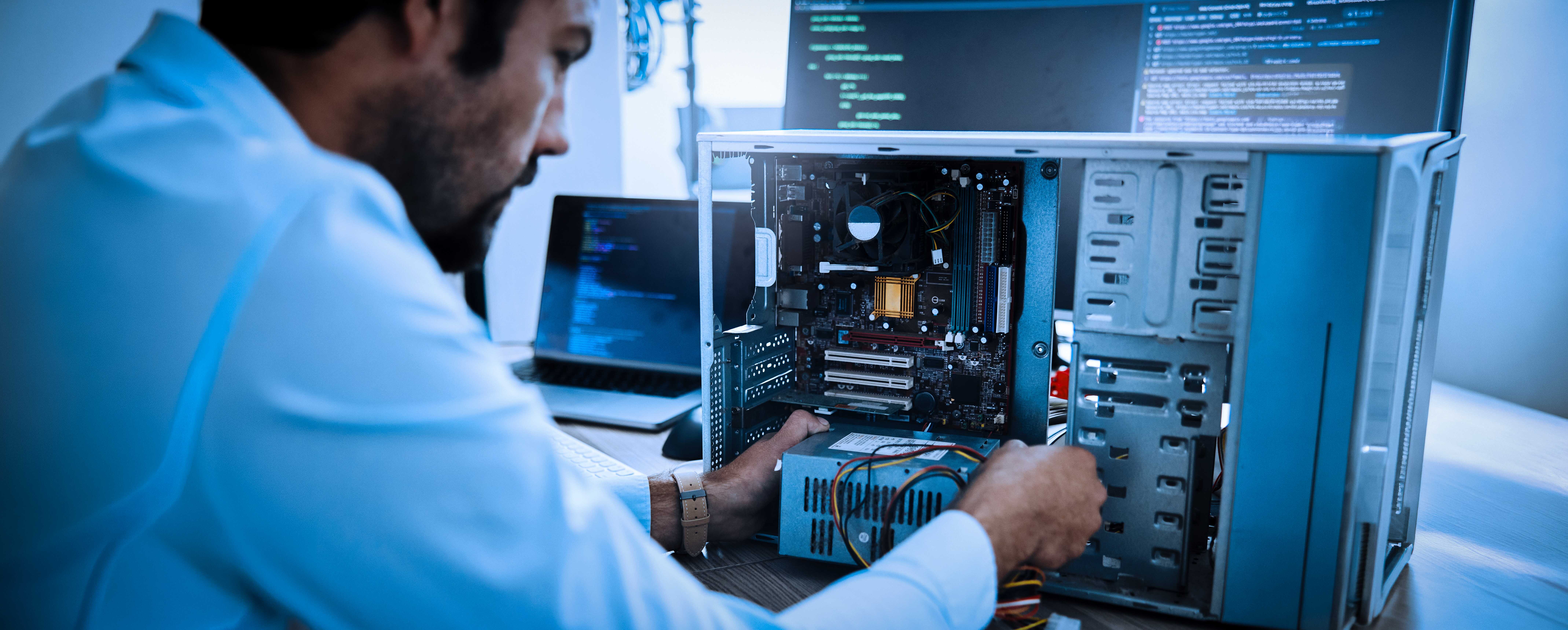 It Technician, Engineer And Computer Hardware With A Man Working To Fix Or Maintenance Technology. Hands Of Expert It Person In Office Data Center For System Repair, Engineering Or Motherboard Update