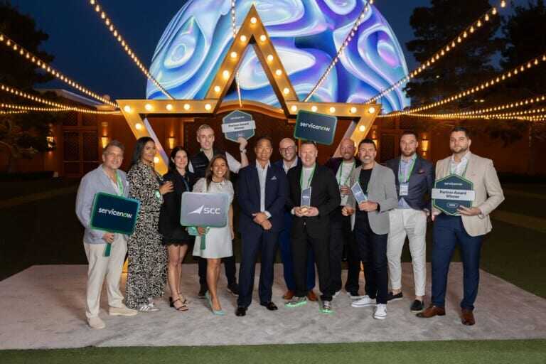 Image of the SCC team receiving awards in person at ServiceNow Knowledge 2026 in Las Vegas.