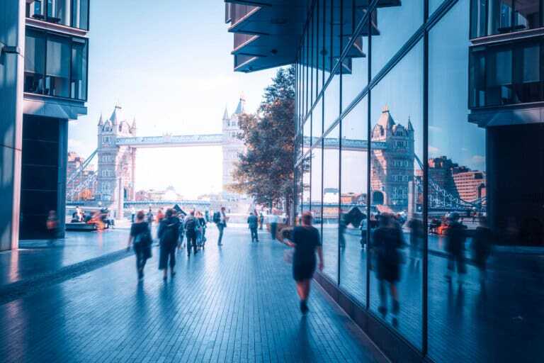 Business People, Modern Buildings And Tower Bridge, London, Uk
