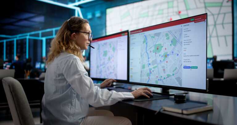 911 Emergency Services: Woman Using Headset To Dispatch Ambulance