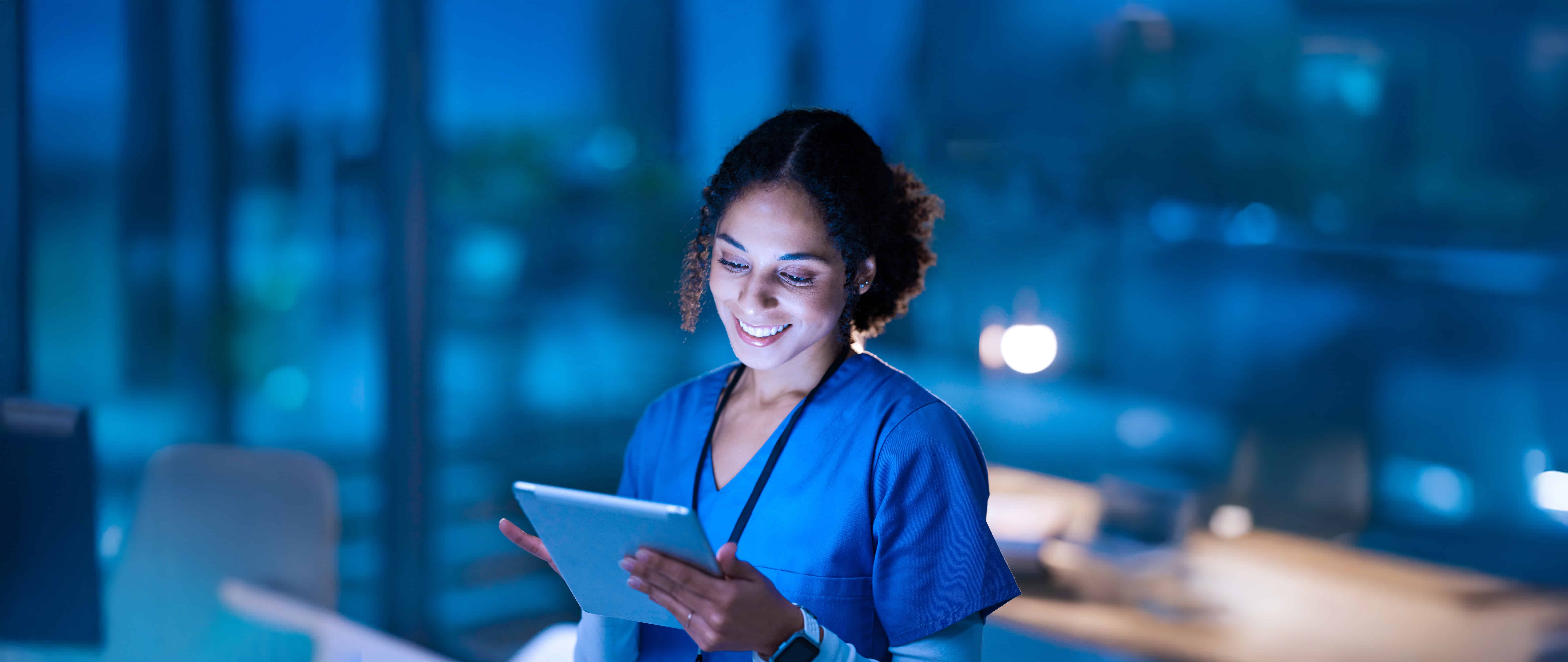 Nurse, Medical Tablet And Black Woman In Hospital Working Late On Telehealth, Research Or Online Consultation. Tech, Healthcare Or Female Physician With Technology For Wellness App In Clinic At Night
