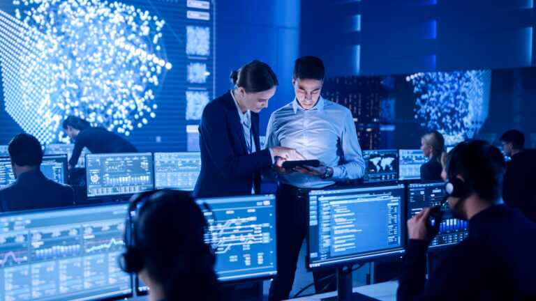 Project Manager And Computer Science Engineer Talking While Usin