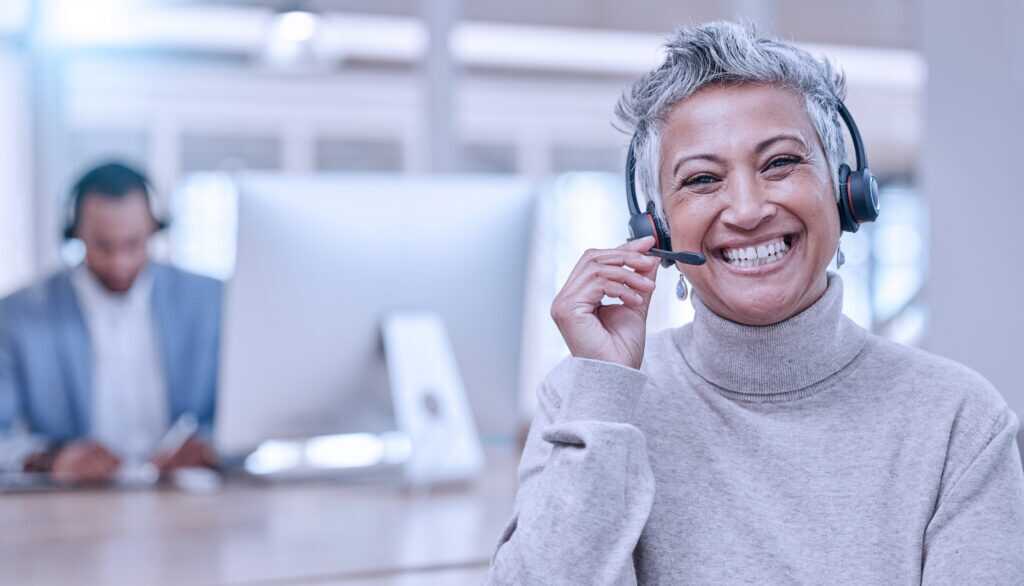 Call Center, Mature And Face Of Woman With Microphone In Office For Telemarketing, Support Or Contact. Smile, Portrait And Customer Service Professional, Sales Manager Or Happy Consultant Listening