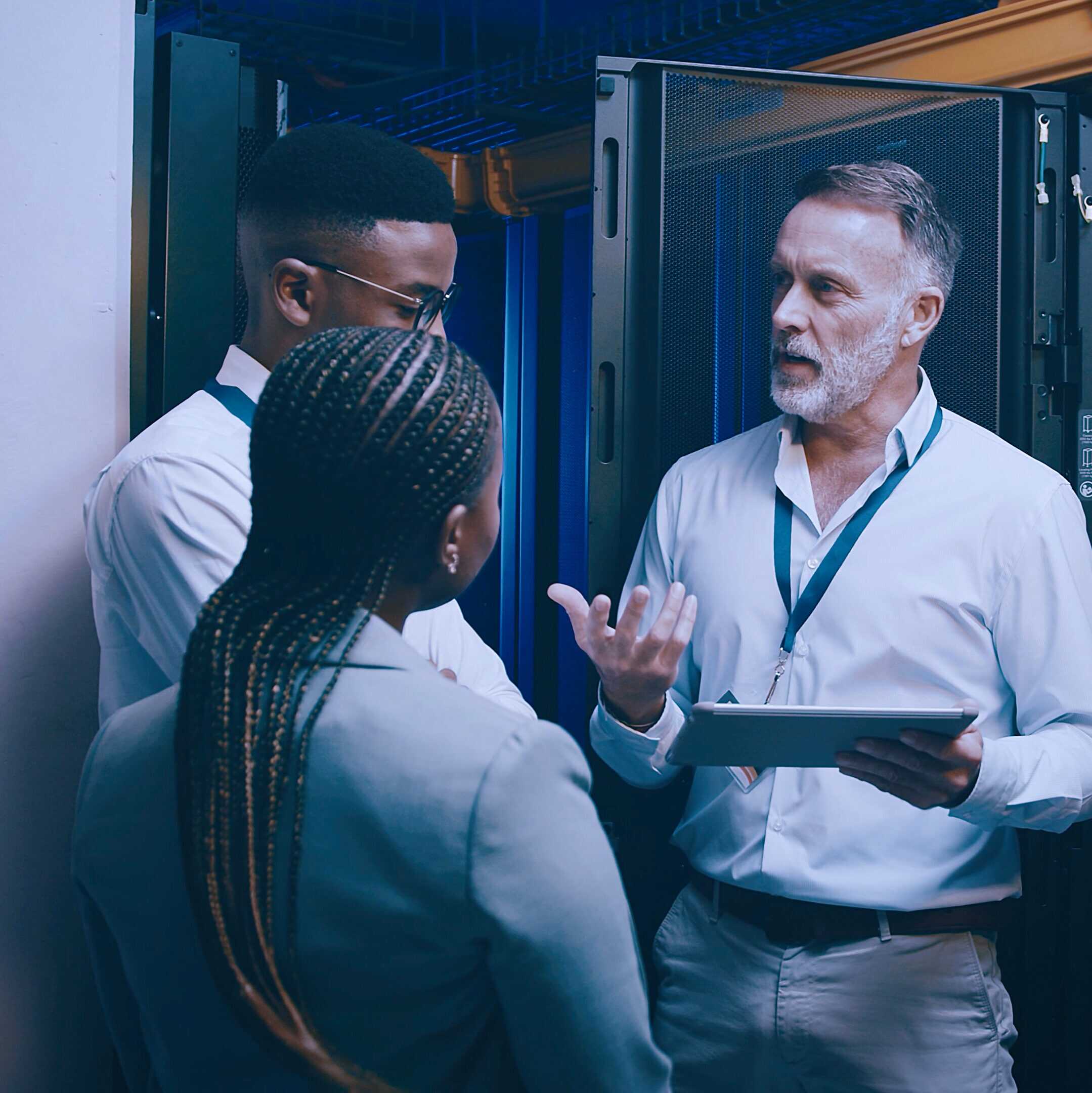 Server Room, Training And Manager With People On Tablet For Cybersecurity, Diagnostics Test And Maintenance. It Team, Meeting And Worker With Boss For Network, Online Database And Technical Support
