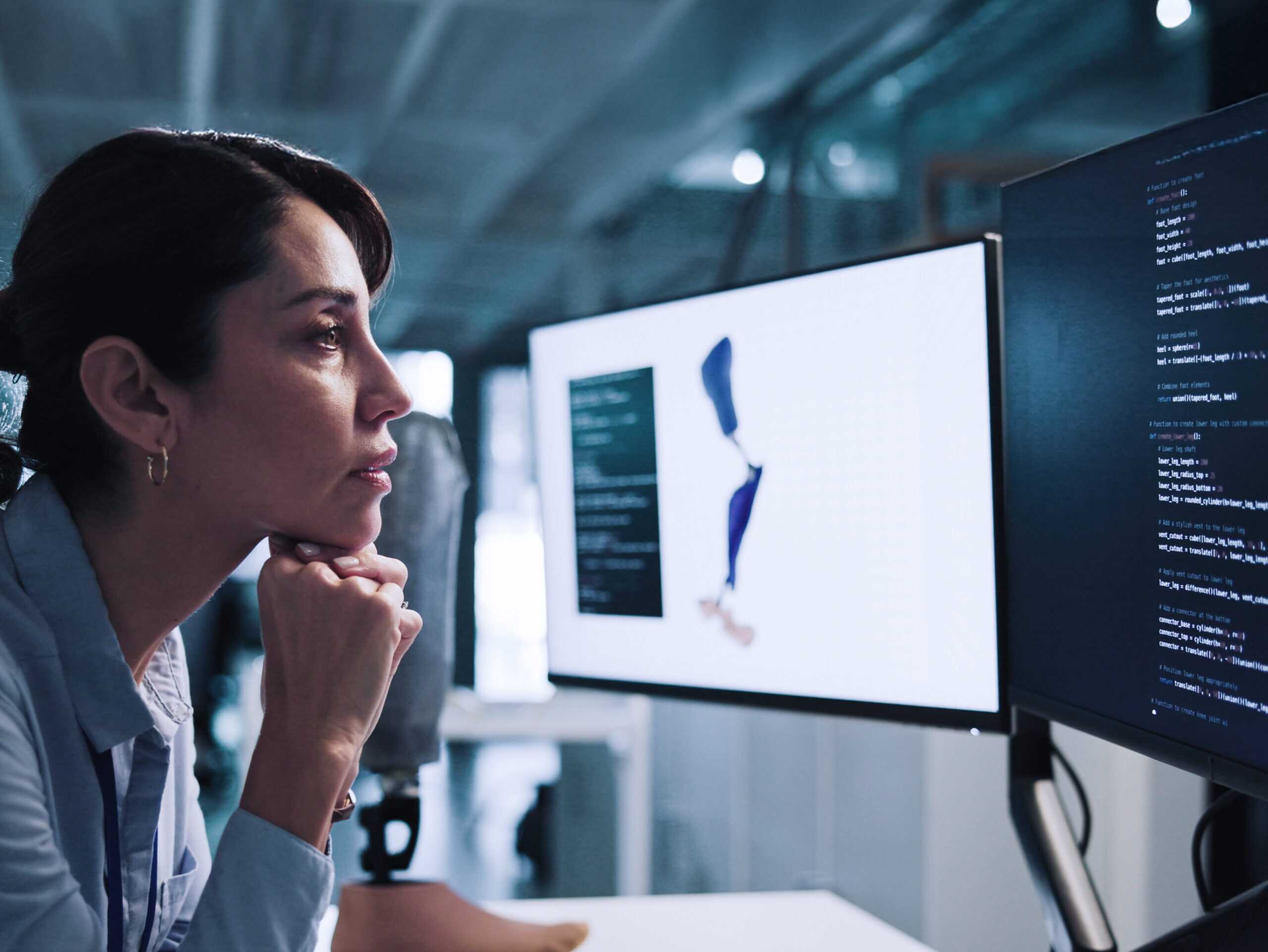 Woman, Thinking And Developer With Design For Prosthetic Leg, Programming Or 3d Printing In Lab. Thoughtful, Female Person Or Biomedical Engineer Contemplating On Computer For Artificial Development